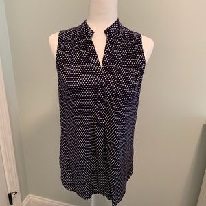 Navy blue and white polka dot sleeveless blouse